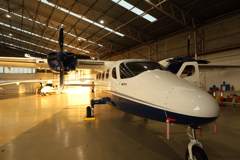 Twin-engine aircraft inside a hangar used for advanced instrument rating (IR) training and multi-engine endorsements in commercial flight programs.